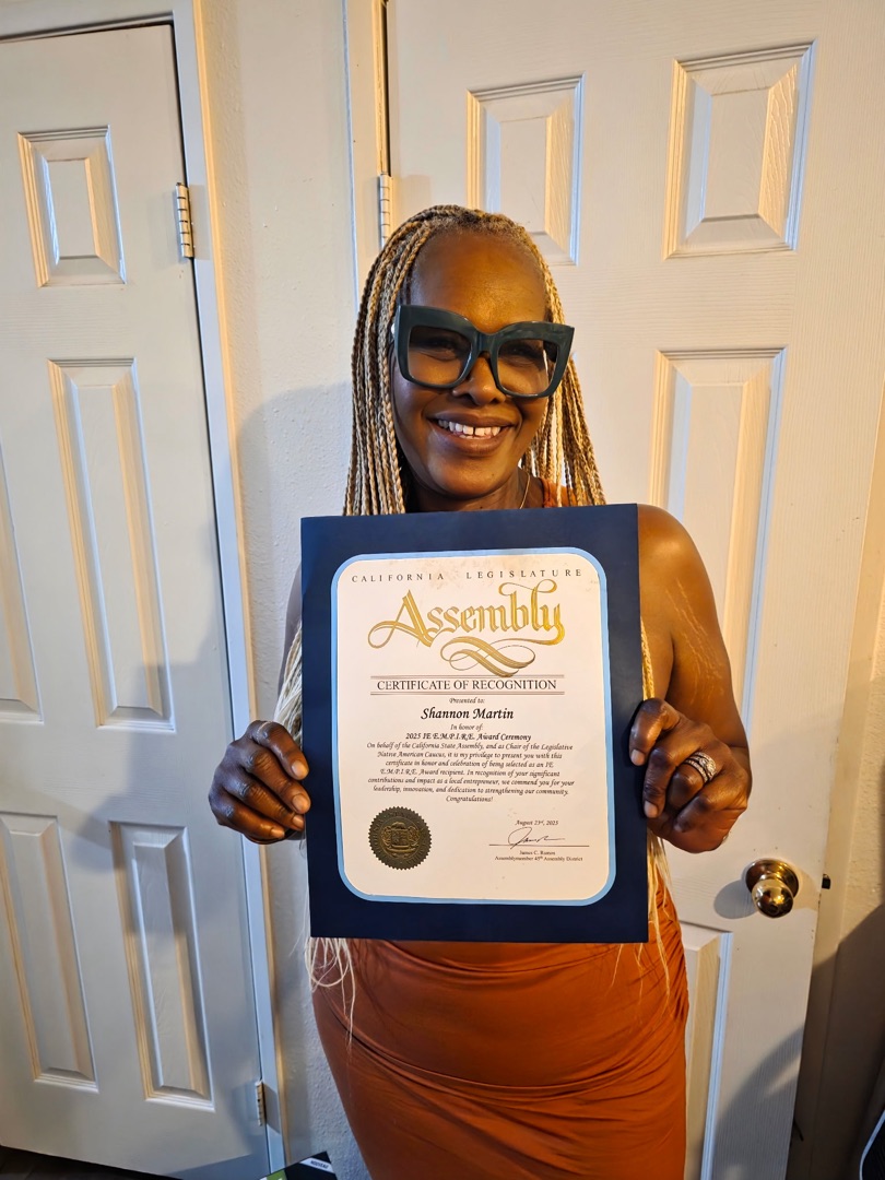 Shannon Martin holding CA State Assembly Certificate of Recognition from Assemblymember James C. Ramos