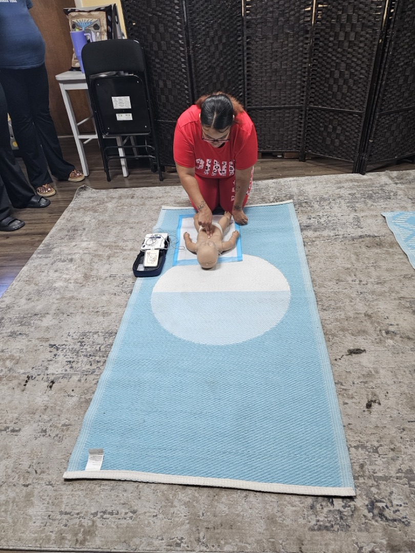 Infant CPR training with mannequin