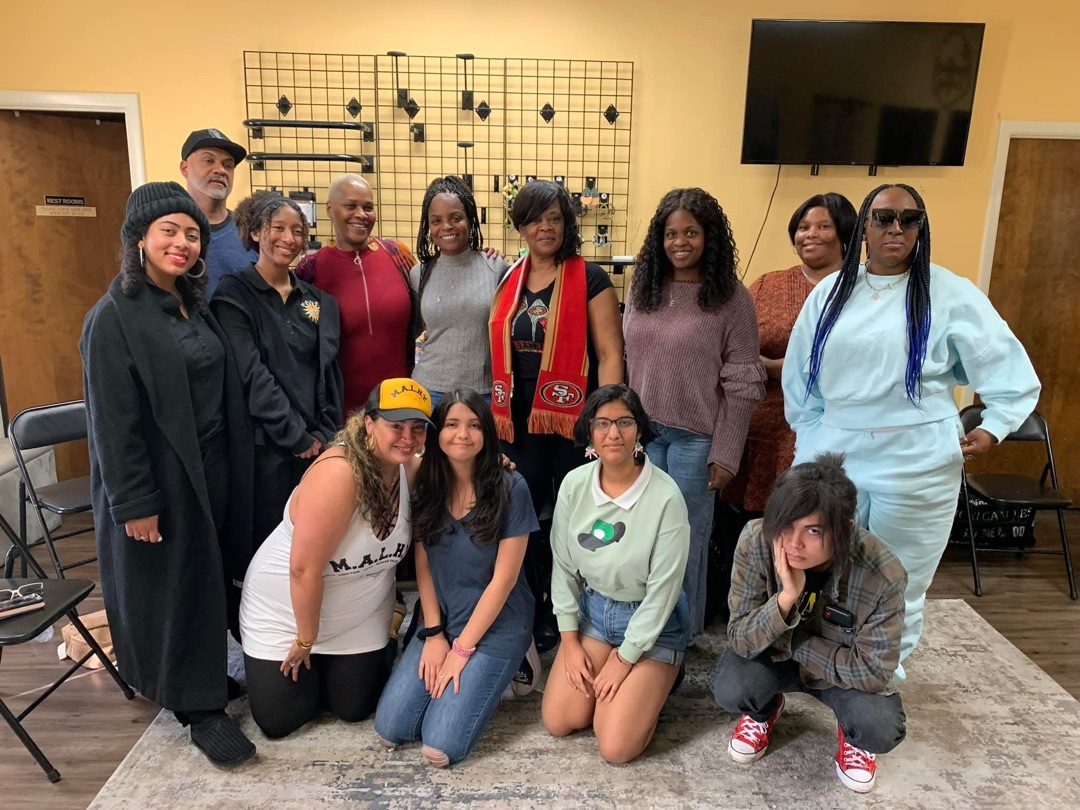 Full group photo from M.A.L.H.N.Y human trafficking conference with youth and community members