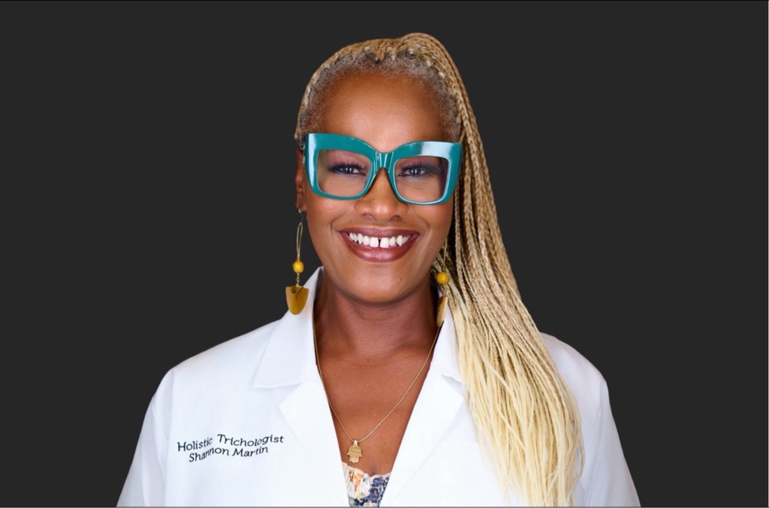 Shannon Martin, Holistic Trichologist, in her professional white coat